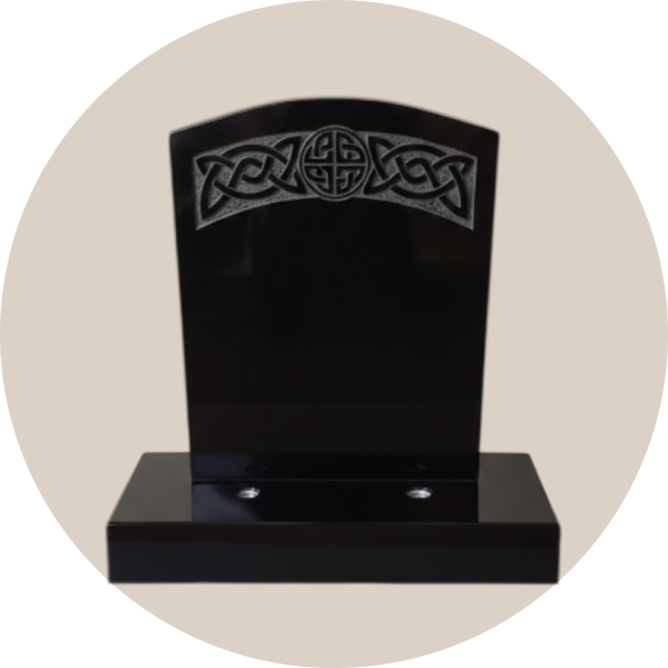 black camber top headstone with hand-carved